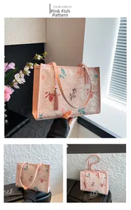 Detail of pink tote bag featuring fish embroidery and elegant tassel decoration