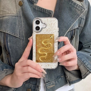 Detail of iPhone case featuring golden foil, glitter, and an embossed snake metal plate