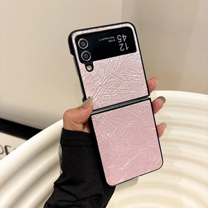 Detail of pink crinkle texture leather case with black trim for Samsung Z Flip 6
