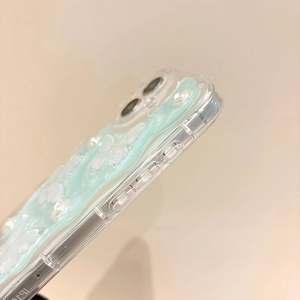 Detail showing 3D mint green wavy jelly texture on clear iPhone 16 Pro Max case
