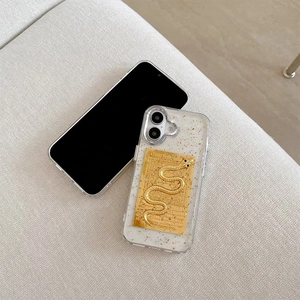 Golden snake embossed phone case for iPhone 16 Pro with gold foil glitters and epoxy finish