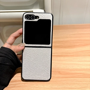 Detail view of grey textured leather folding phone case with a slim fit and precise camera cutouts
