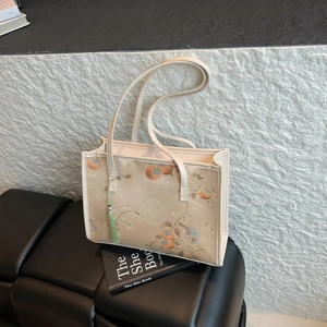 Chinese style embroidered tote bag with persimmon bird pattern and green tassel