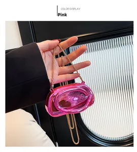 Metallic pink acrylic handbag with oval hollow design and gold chain detail