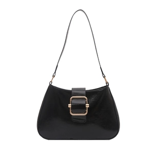Minimalist black glossy leather underarm bag with elegant gold metal buckle detail