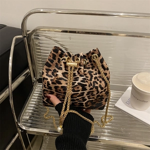 Fashionable leopard print bucket bag with gold chain strap and pearl charm accent