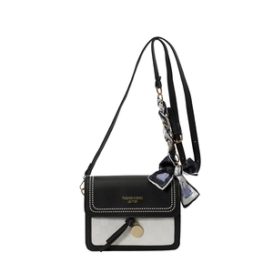 Minimalist black and white contrast crossbody bag with chic silk scarf and gold rivet detail