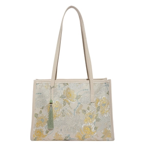 Elegant Chinese style floral embroidery tote bag with beige leather handles and tassel charm