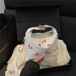White corduroy handbag with cherry embroidery and gold metal clasp in a gift box