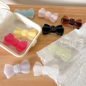 Lot de dix supports de téléphone extensibles en forme de nœud aux couleurs pastel variées
