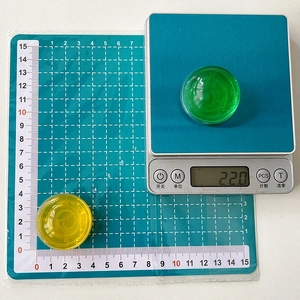 Detail view of colorful transparent crystal ball phone grip showing weight and diameter size