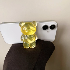 Detailed close-up showing yellow translucent bear-shaped expandable phone grip socket