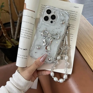 Sparkly iPhone case with metallic bow, silver beads and long beaded wrist strap