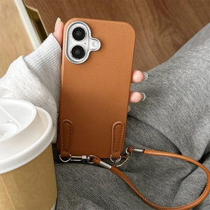 Brown litchi leather phone case with cross-body strap and silver camera protector