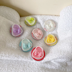 3D bow resin heart phone socket grips in pastel colors with Good Luck lettering