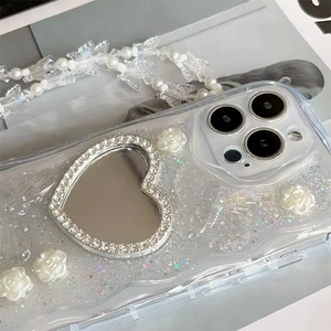 Glittery heart mirror iPhone case with resin flowers and butterfly pearl charm