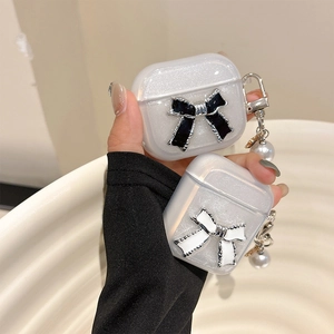 Funda para AirPods transparente con purpurina, lazo 3D y llavero de perlas finas