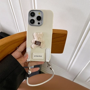 Detail of plush bear iPhone case with beige leather texture and detachable lanyard strap