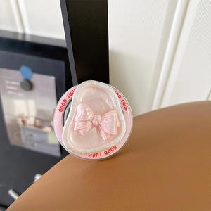 Pink bow magnetic phone grip with Good Luck text and pearlescent resin finish