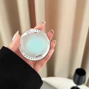 Close-up of apple-shaped magnetic phone grip with Gift For You print in light green
