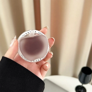 Detail of purple matte apple phone grip with Gift For You print and white ring base