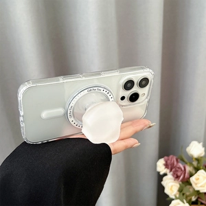 Close-up of a white flower-shaped magnetic phone grip on a clear iPhone case with text