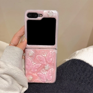 Close-up of pink glitter folding phone case with 3D butterfly and rose decorations