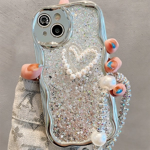 Detail of silver wavy electroplated phone case with heart pearl charm and chain handle