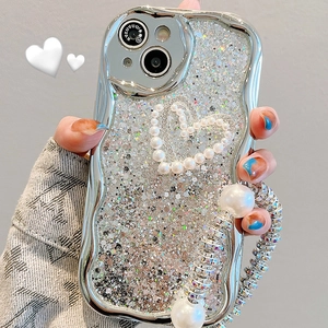 Silver glitter iPhone case with wavy edges featuring a pearl heart and elegant chain strap