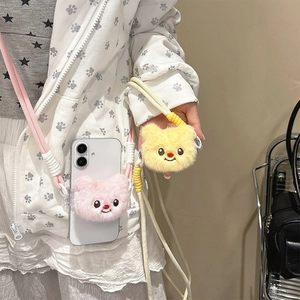 Detail of cute plush bear phone lanyard with adjustable crossbody strap in pink and yellow