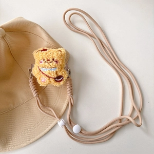 Detail of cute yellow plush bear charm with adjustable thick crossbody strap for phone