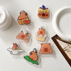 Rotating acrylic capybara phone socket holders in cute cartoon designs for smartphones