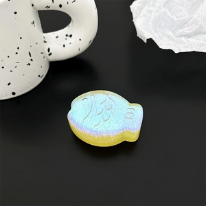 Macro shot of creative 3D fish phone grip with iridescent gradient and pearl finish