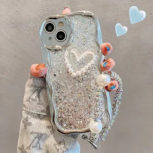 Silver wavy plated iPhone case with heart pearl inlay and luxury diamond chain strap