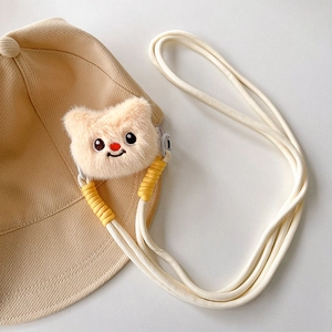 Detail of baby beige bucket hat with plush animal decor and adjustable lanyard cord