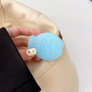 Close-up of a light blue Taiyaki fish collapsible phone grip held in hand for detail