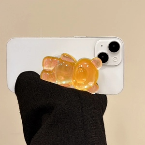 3D holographic bear phone socket grip in translucent orange resin on a smartphone