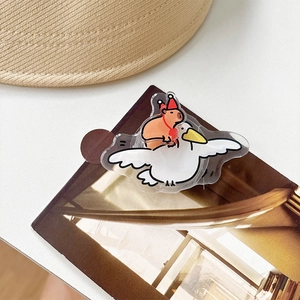 Detail of cute Capybara riding seagull acrylic phone socket on a lifestyle background