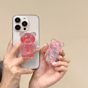Detail of 3D bear phone griptoks with iridescent aurora purple finish and jelly texture