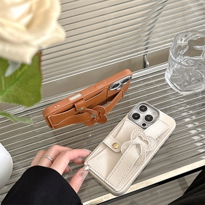 Detail of leather phone case with flower grip and card holder for iPhone 15/17 Pro Max
