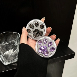 Sparkling crystal cat paw magnetic phone grip in black and purple with rhinestones