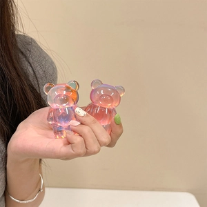 Detail shot of laser iridescent resin bear phone grips with colorful gradient reflections