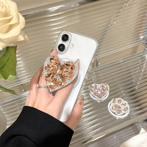 Sparkling cat paw and heart magnetic phone grip with champagne crystals on a smartphone