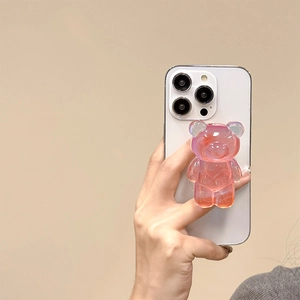 Close-up of a 3D laser transparent bear phone socket holder with holographic resin effect
