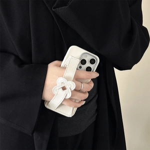 White leather iPhone case with hand strap and floral button decoration for women
