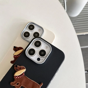 Detail of faux leather phone case featuring exquisite dachshund embroidery and metal camera ring