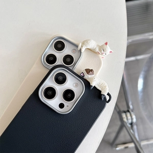 Close-up of cute 3D cat decorations on faux leather texture iPhone cases in two colors