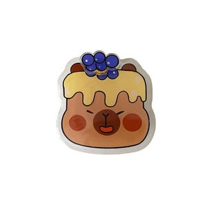 Cartoon Capybara rotatable phone grip and stand with blue berry design on white background