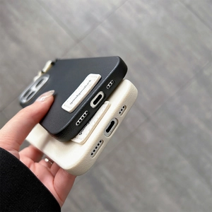 Close-up of litchi texture faux leather phone case with stitched label and bottom cutouts