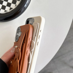 Close-up of litchi texture leather phone case with card slot and wrist strap for iPhone